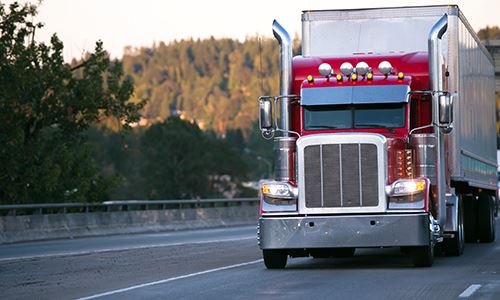 Semi-truck driving on a road